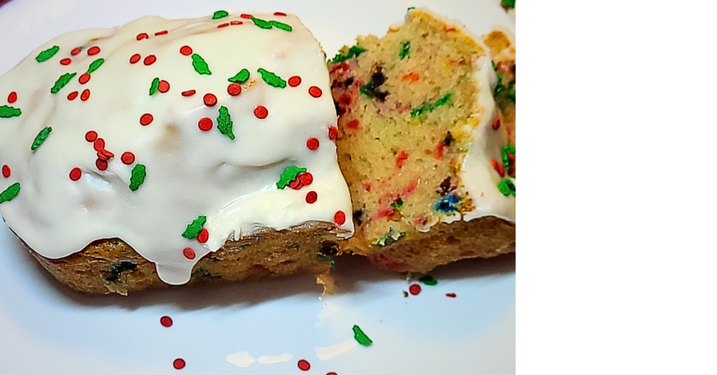 Christmas Funfetti Bread sliced on a plate